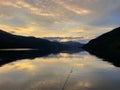 Person fishing in a tranquil lake