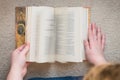 Person Flipping through the Pages of a Book