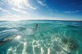 person, floating in the ocean, with crystal-clear water and sunny skies