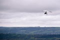 Person flying away into the horizon on a small aircraft single seat microlight as a hobby or sport in the air Royalty Free Stock Photo