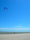 Person flying kite on beach