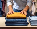 Person Folding Clothes in Laundry Room or Closet Royalty Free Stock Photo
