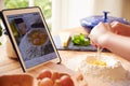 Person Following Pasta Recipe Using App On Digital Tablet