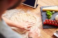 Person Following Pizza Recipe Using App On Digital Tablet Royalty Free Stock Photo