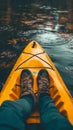 a person foot in a yellow kayak on lake