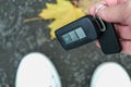 A person found and picked up from the ground lost car auto keys Royalty Free Stock Photo