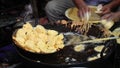 Frying batata wada in hot oil