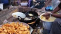 Frying batata wada in hot oil