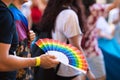 A person with a gay pride fan during the demonstration for the rights of homosexuals and LGBTQ people in the city of Seville,