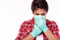 Person get infected some virus, flu, coronavirus, covid 19. Young man wear glove, face mask for protecting of spreading virus, flu Royalty Free Stock Photo