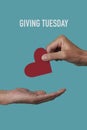 Person giving a heart and text giving tuesday