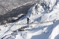 person in mountains on the suspension bridge