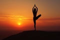 A person gracefully practicing a yoga pose in the backdrop of a vibrant sunset, A woman practicing yoga at sunrise, AI Generated