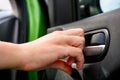 Person hand closing car interior door