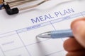 Person Hand Filling Meal Plan Form Royalty Free Stock Photo