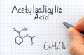 Person hand with pen writing chemical formula of Acetylsalicylic Acid. Royalty Free Stock Photo