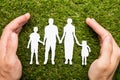 Person Hand Protecting Family Papercut