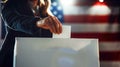 A person hand putting away ballot paper in a white voting box Royalty Free Stock Photo