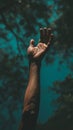 Person Hand Reaching Up Into the Blue Sky