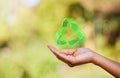 Person, hand and recycle sign with hologram, carbon footprint and save the earth with sustainable waste management Royalty Free Stock Photo