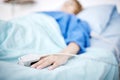 Person, hand or sleeping in hospital bed for medical treatment, surgery and icu operation in clinic. Tired, blur or sick