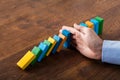 Person Hand Stopping Dominoes Royalty Free Stock Photo