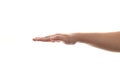 Person hand in straight push down or hold gesture, side view Royalty Free Stock Photo