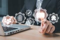 Person hand working on laptop computer and pointing gear with VR screen iso icon background Royalty Free Stock Photo