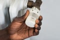 Person Hands Adjusting Thermostat Radiator