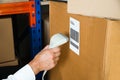 Person Hands With Barcode Scanner Scanning Box