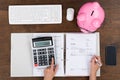 Person Hands Calculating Receipt At Desk