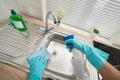 Person hands cleaning kitchen sink Royalty Free Stock Photo