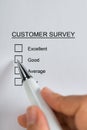 Person Hands Filling Customer Survey Form