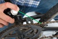 Person Hands Lubricating Bike