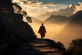 A person hikes up a hill, enjoying the breathtaking view of majestic mountains in the distance., A solitary monk walking a