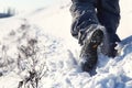 Person hiking on the mountaintop covered with snow low angle view Royalty Free Stock Photo