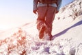 Person hiking on the mountaintop covered with snow low angle view Royalty Free Stock Photo