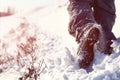 Person hiking on the mountaintop covered with snow low angle view Royalty Free Stock Photo