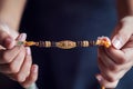 A Person Holding A Beautiful Rakhi