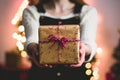 A Person Holding A Beautifully Wrapped Gift Box With A Bow Royalty Free Stock Photo