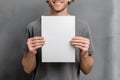 Person holding blank white paper with a smile Royalty Free Stock Photo