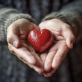 Person holding broken heart in their hands Royalty Free Stock Photo