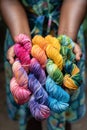 Person holding of colorful skeins hand dyed woolen yarn Royalty Free Stock Photo