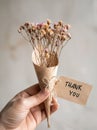 Person Holding Bunch of Dried Flowers