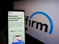 Person holding cellphone with website of US financial technology company Affirm Holdings Inc. on screen with logo.