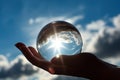 A person holding a crystal ball in their hand. Generative AI image. Royalty Free Stock Photo