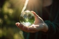 A person holding a crystal ball in their hands. Generative AI image. Royalty Free Stock Photo
