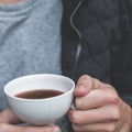 Person holding cup of coffee Royalty Free Stock Photo