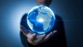 Person holding a digital globe in hands Royalty Free Stock Photo