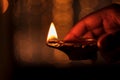 Person Holding Diwali Diya